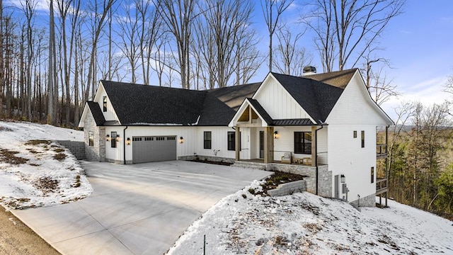 modern farmhouse style home featuring a garage