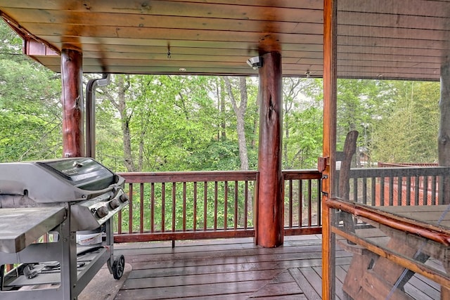 wooden terrace featuring area for grilling