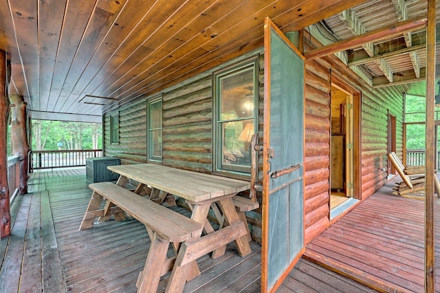 wooden deck with ceiling fan and a porch