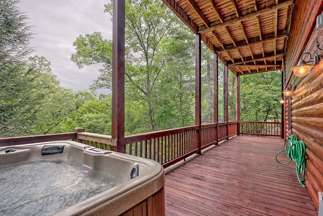 deck featuring a hot tub