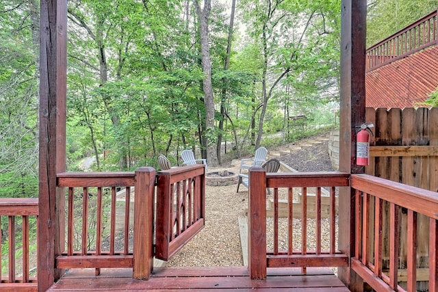 wooden deck featuring a fire pit