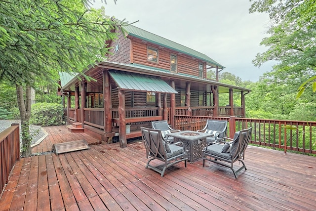 deck featuring a fire pit