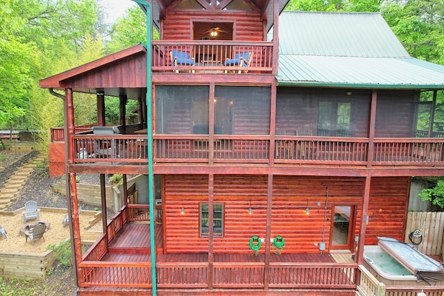 back of property with a sunroom