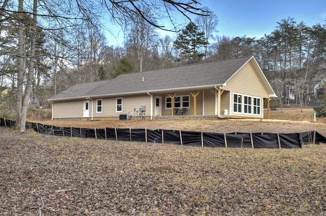 rear view of property featuring central AC