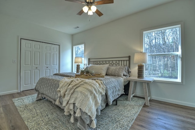 bedroom featuring a closet, ceiling fan, and light wood-type flooring