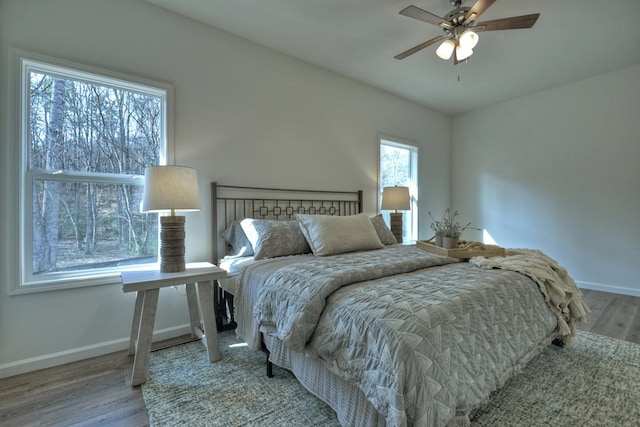 bedroom with wood-type flooring and ceiling fan