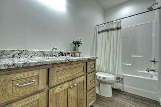 full bathroom with shower / tub combo with curtain, vanity, toilet, and hardwood / wood-style floors