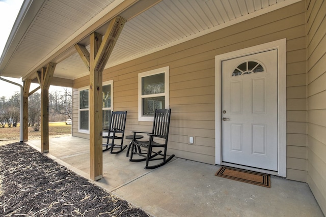 doorway to property with covered porch