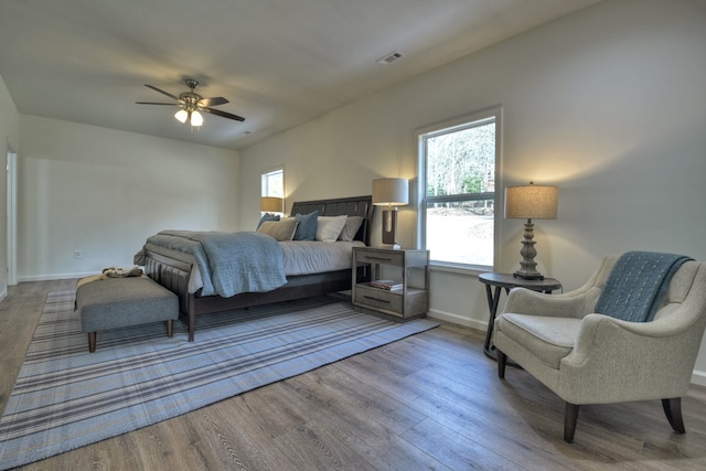 bedroom with wood-type flooring and ceiling fan