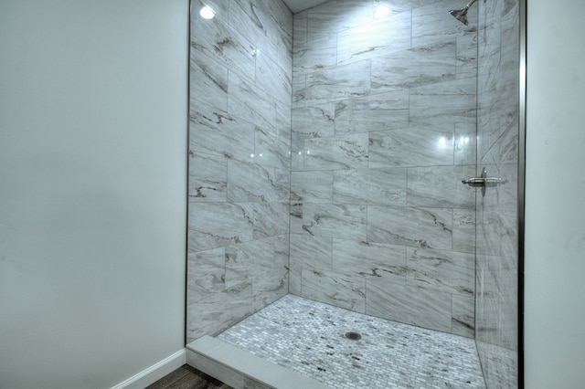 bathroom with a tile shower