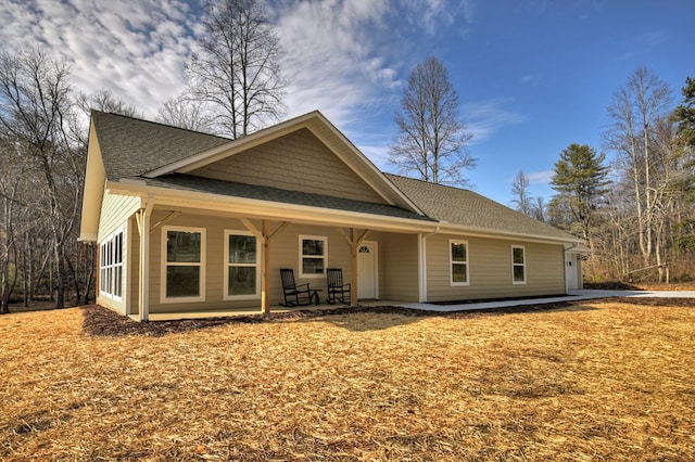 view of front facade with a garage and covered porch