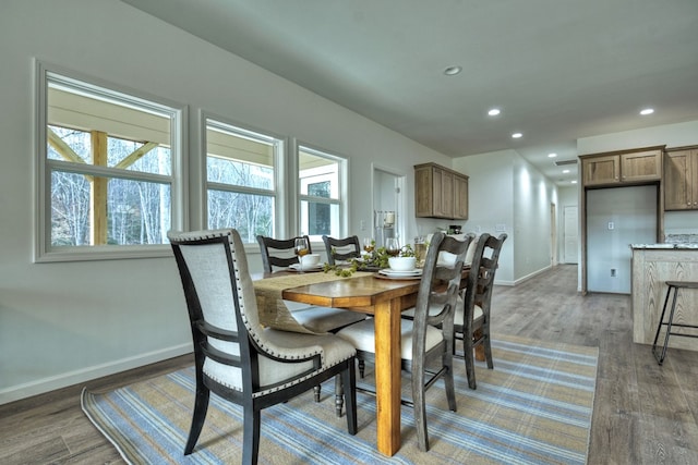 dining area featuring dark hardwood / wood-style flooring