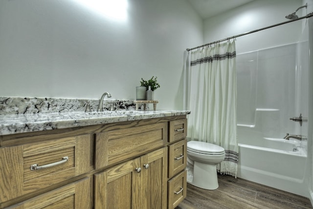 full bathroom featuring hardwood / wood-style flooring, vanity, shower / bathtub combination with curtain, and toilet