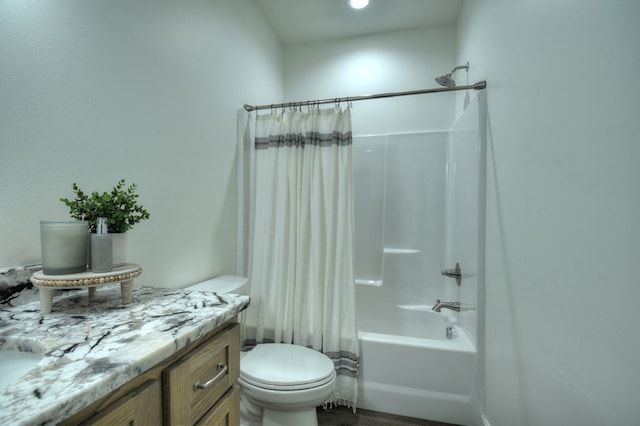 full bathroom with vanity, shower / bath combination with curtain, and toilet