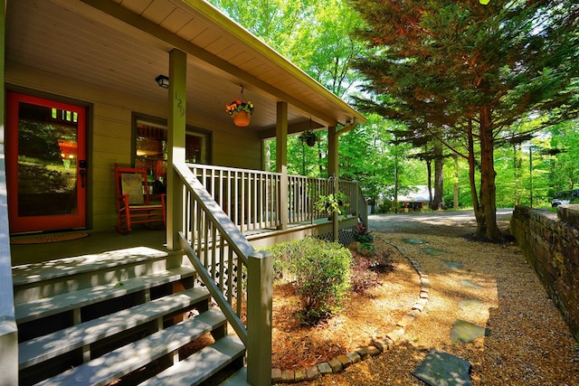 doorway to property with covered porch