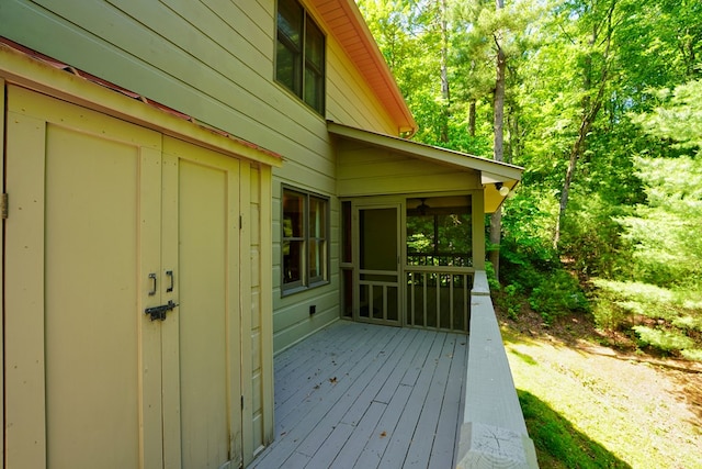 wooden terrace with a sunroom