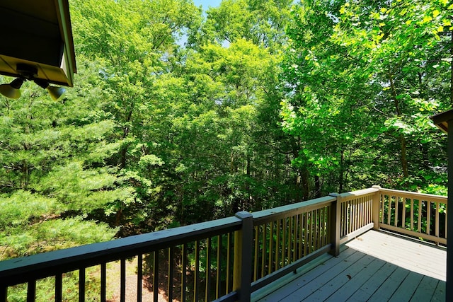 wooden terrace with a forest view