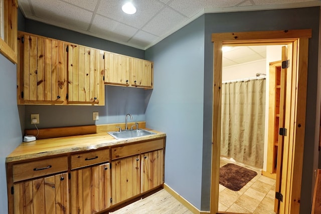 kitchen with a sink and light countertops