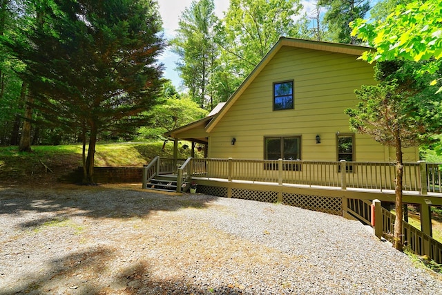 view of front of home featuring a wooden deck