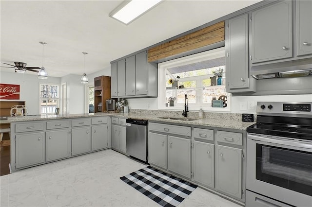 kitchen featuring sink, hanging light fixtures, gray cabinets, kitchen peninsula, and stainless steel appliances