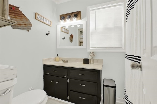 bathroom with vanity and toilet