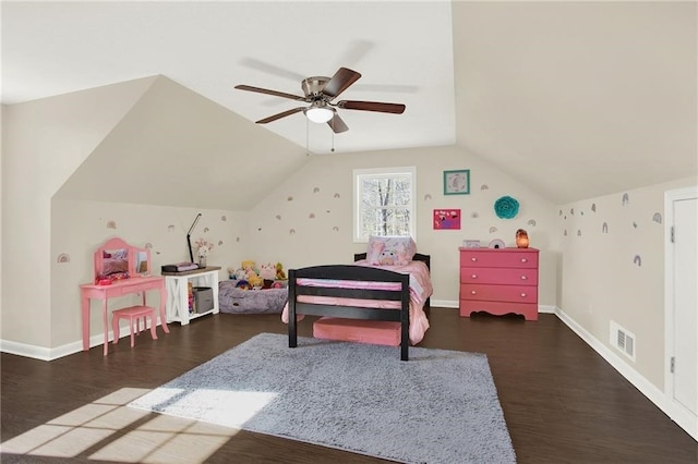 bedroom with dark hardwood / wood-style flooring, vaulted ceiling, and ceiling fan