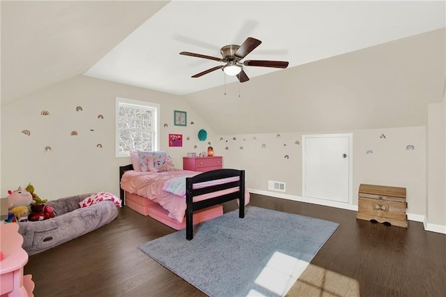 bedroom with dark hardwood / wood-style flooring, lofted ceiling, and ceiling fan