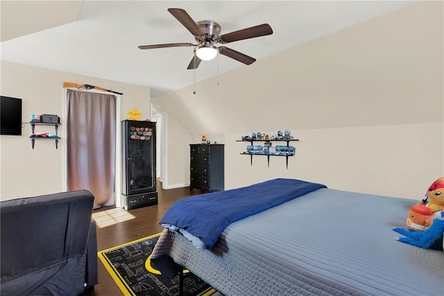 bedroom featuring vaulted ceiling, ceiling fan, and dark hardwood / wood-style flooring