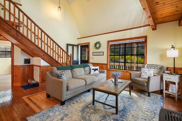 living room with high vaulted ceiling, dark hardwood / wood-style flooring, wooden ceiling, and beamed ceiling