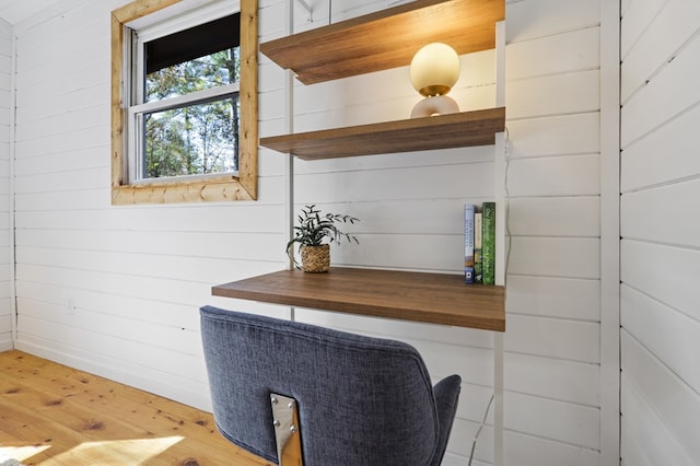 interior space with wooden walls and wood-type flooring