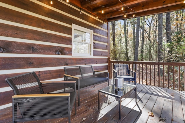 wooden terrace with outdoor lounge area