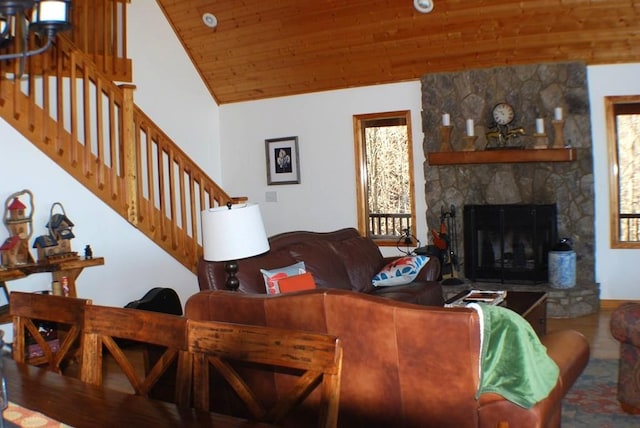 living room featuring stairs, wooden ceiling, plenty of natural light, and vaulted ceiling