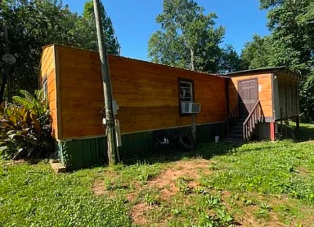 view of home's exterior with cooling unit