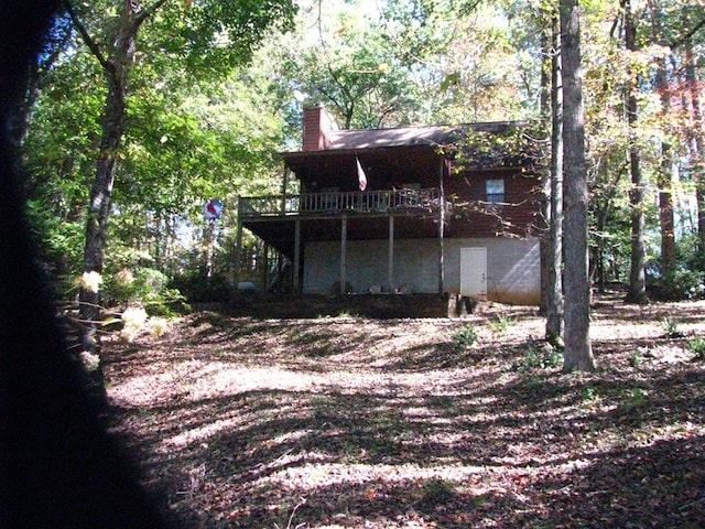 2520 Rd 4748, Hiawassee, GA 30546 - back of house with stairs, a chimney, and a wooden deck