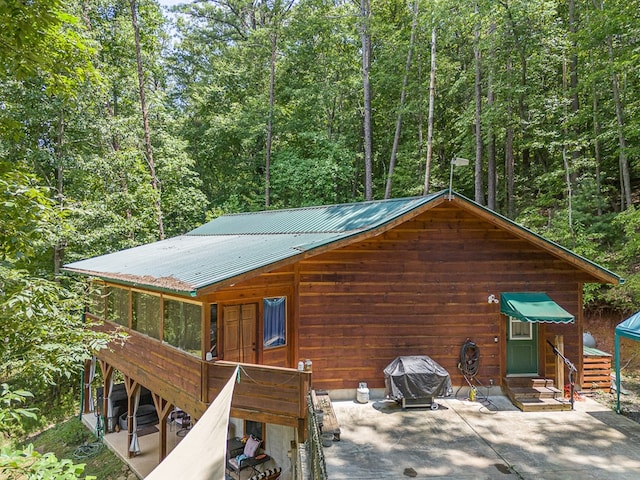 rear view of property featuring a patio