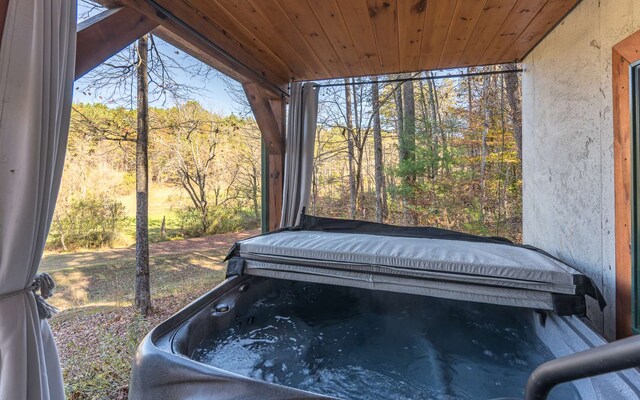 interior details featuring wooden ceiling and a hot tub