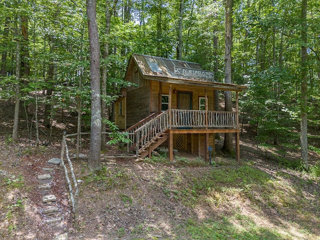 cabin featuring a porch