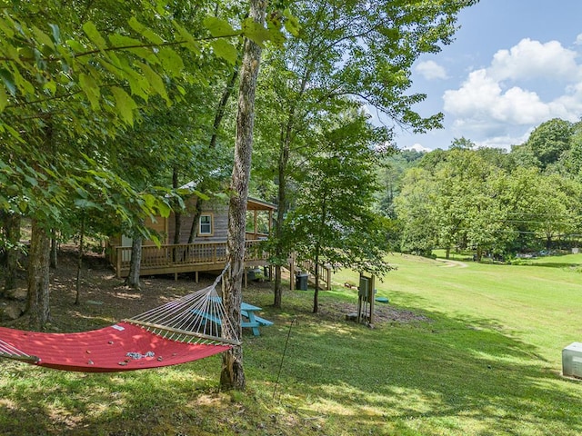 view of yard featuring a wooden deck