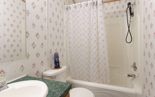 full bathroom with vanity, shower / tub combo with curtain, and toilet