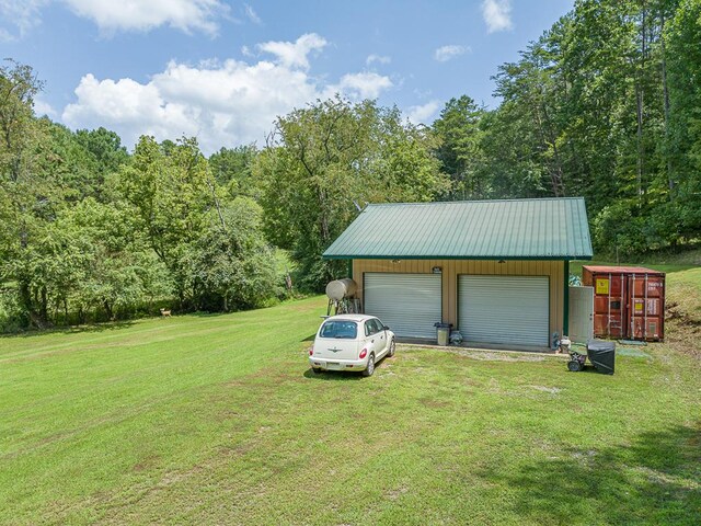 garage with a yard