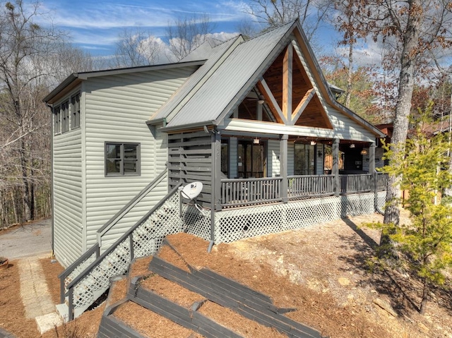 view of front of house featuring a porch and metal roof