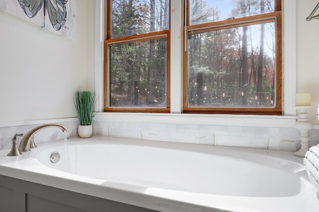 bathroom featuring a tub to relax in