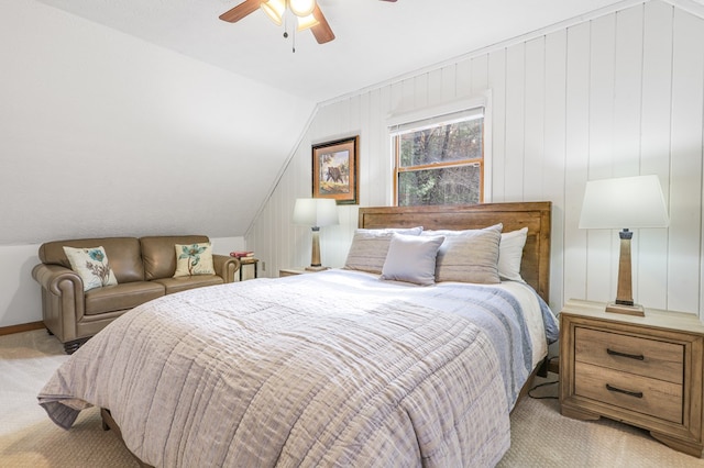 bedroom featuring ceiling fan, light carpet, and vaulted ceiling