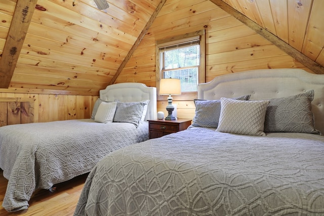 bedroom featuring wood ceiling, wooden walls, wood-type flooring, and vaulted ceiling