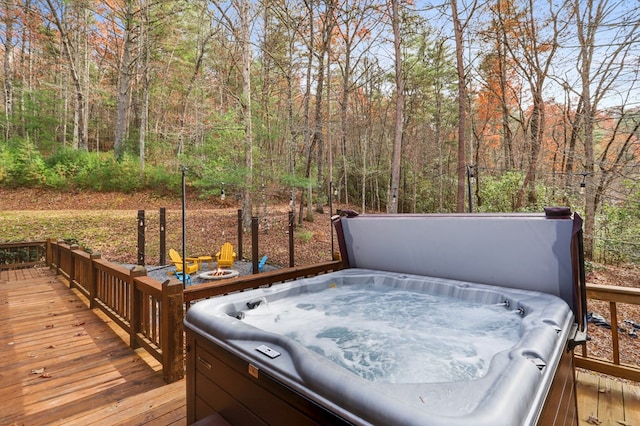 wooden terrace featuring a hot tub