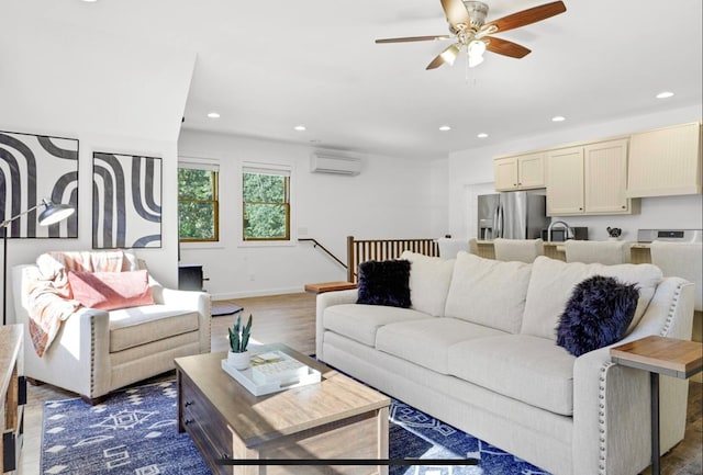 living room featuring ceiling fan, dark hardwood / wood-style flooring, a wall mounted AC, and sink