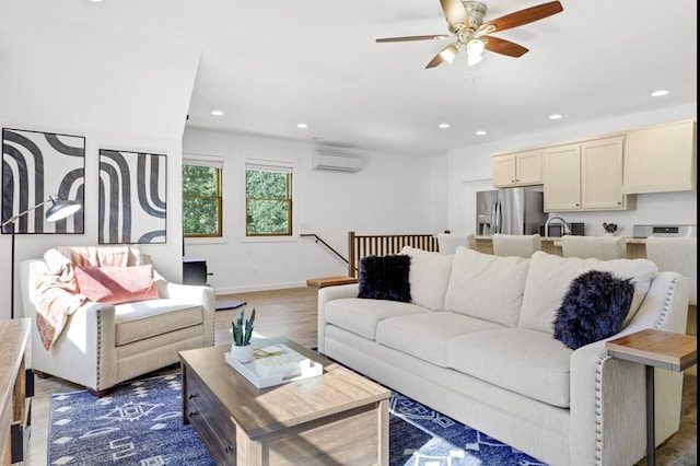 living room featuring sink, a wall mounted AC, dark wood-type flooring, and ceiling fan