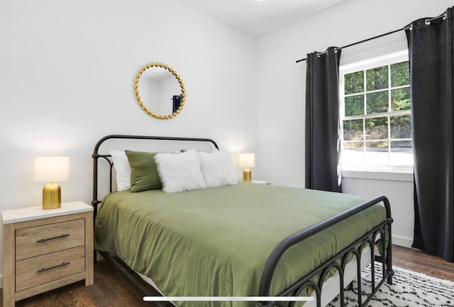 bedroom featuring dark hardwood / wood-style flooring