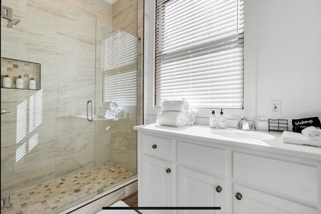 bathroom featuring vanity and walk in shower