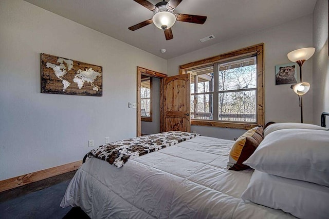 bedroom featuring baseboards, visible vents, and a ceiling fan